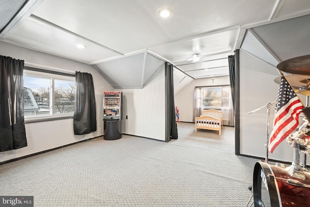 bonus room featuring lofted ceiling and carpet floors