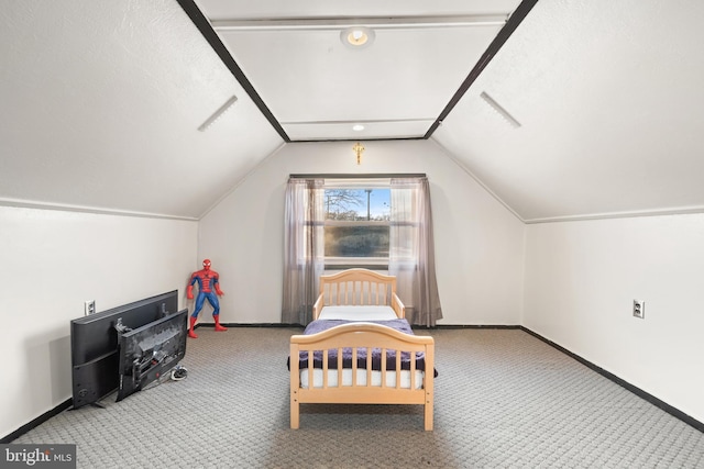 carpeted bedroom featuring lofted ceiling