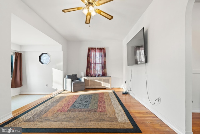 interior space with hardwood / wood-style floors and ceiling fan