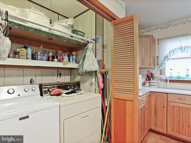 laundry area with separate washer and dryer