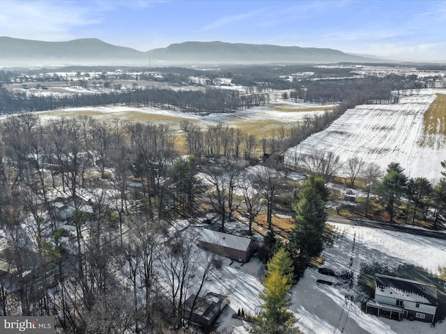 snowy aerial view featuring a mountain view