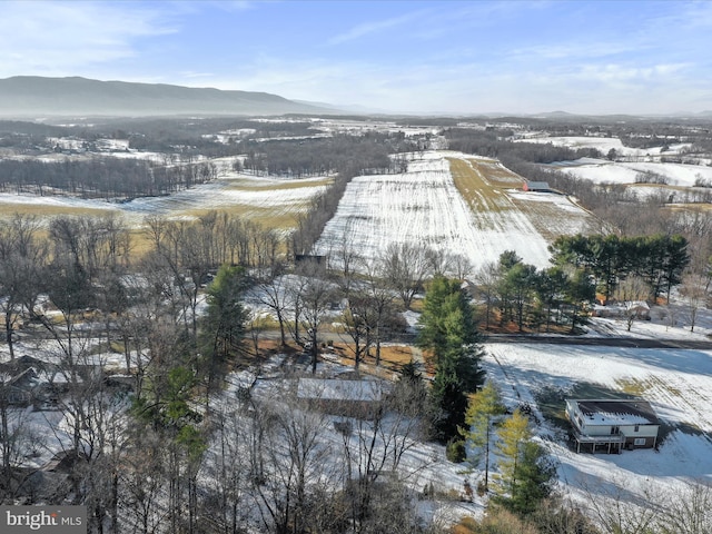 snowy aerial view featuring a mountain view