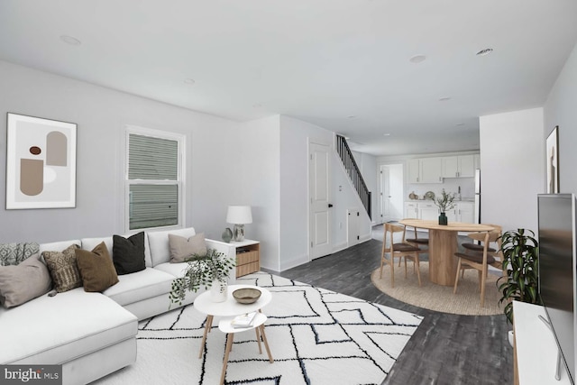 living room featuring dark wood-type flooring