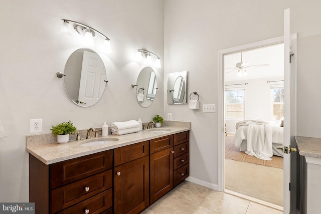 bathroom featuring tile patterned flooring, vanity, and ceiling fan