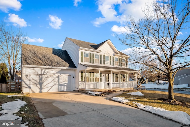 view of front of property with a porch and a garage