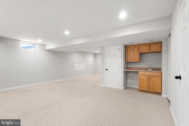 interior space with sink and light carpet