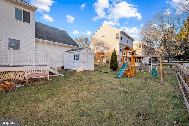 exterior space featuring a playground, a deck, and a shed