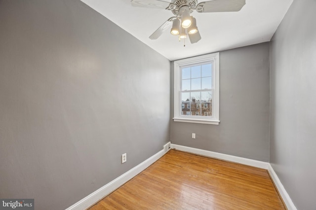 unfurnished room featuring ceiling fan and light wood-type flooring