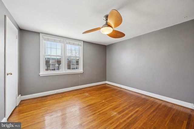 spare room featuring ceiling fan and light wood-type flooring