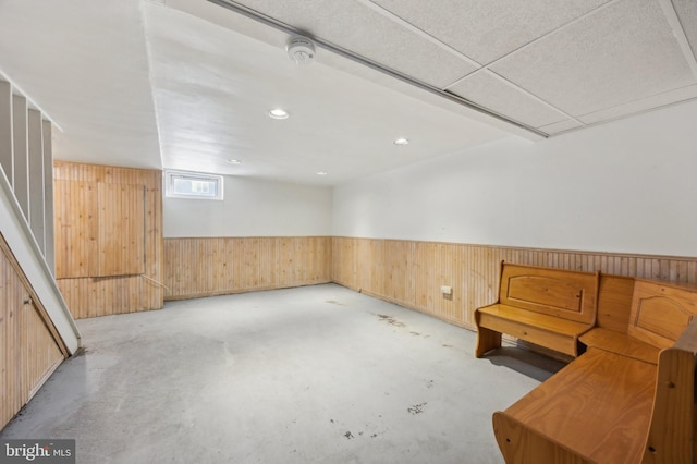 interior space featuring wooden walls