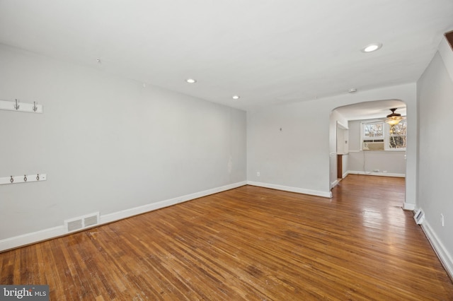 unfurnished room featuring ceiling fan and hardwood / wood-style floors