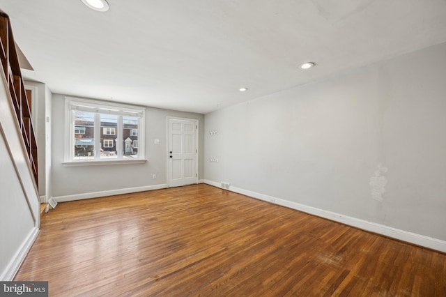 unfurnished room featuring hardwood / wood-style flooring