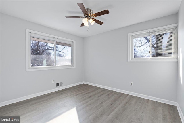 unfurnished room featuring ceiling fan and wood-type flooring