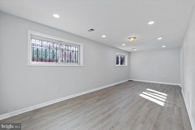 unfurnished room featuring light hardwood / wood-style flooring