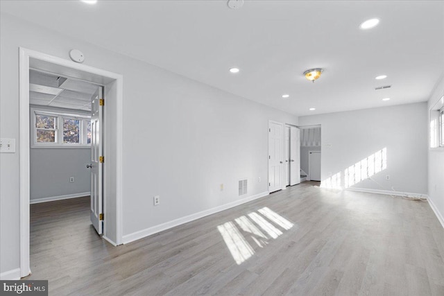 spare room featuring light hardwood / wood-style floors