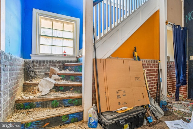 stairway with brick wall