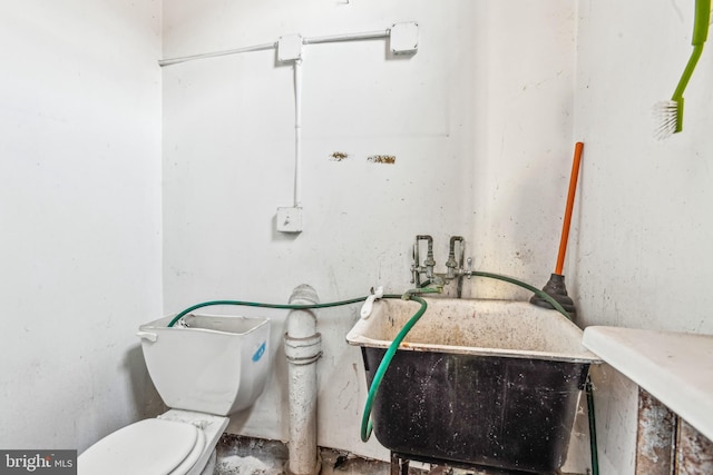 bathroom with sink and toilet