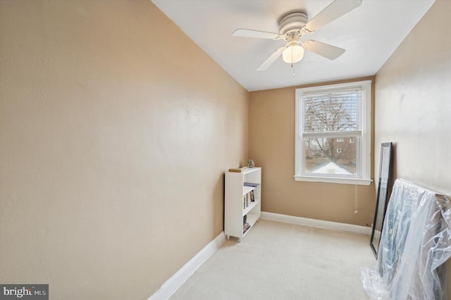 sitting room featuring ceiling fan and light colored carpet