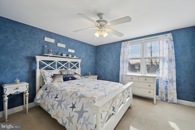 bedroom featuring light carpet and ceiling fan