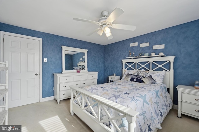 bedroom with light colored carpet and ceiling fan