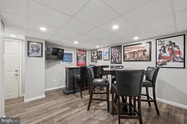 bar with hardwood / wood-style flooring