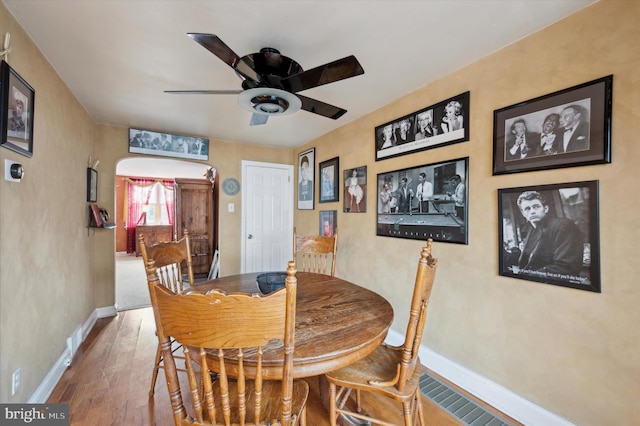 dining area featuring ceiling fan and hardwood / wood-style floors