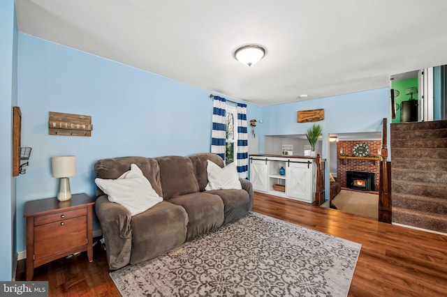 living room featuring a fireplace and dark hardwood / wood-style floors