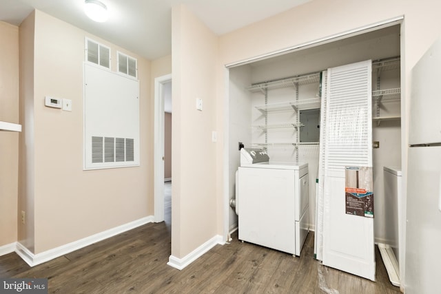 laundry area featuring dark hardwood / wood-style flooring