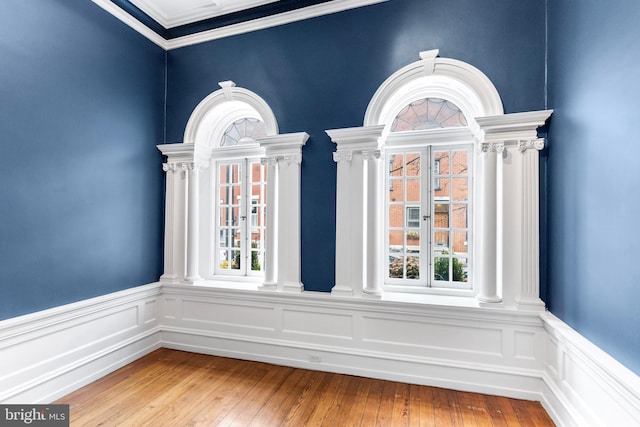 interior details with decorative columns and wood finished floors