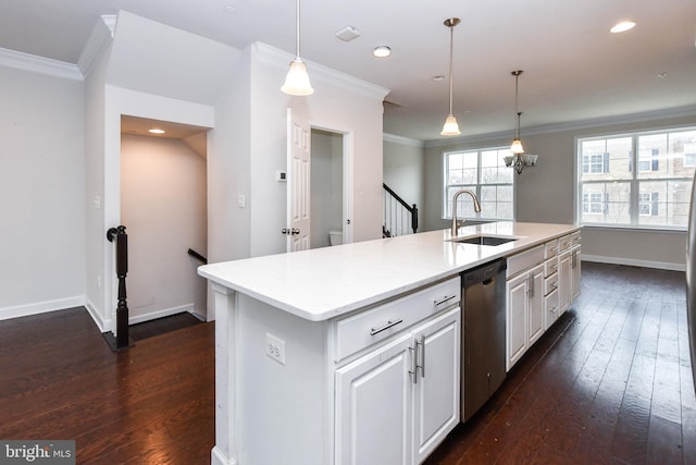 kitchen with sink, ornamental molding, dishwasher, an island with sink, and pendant lighting