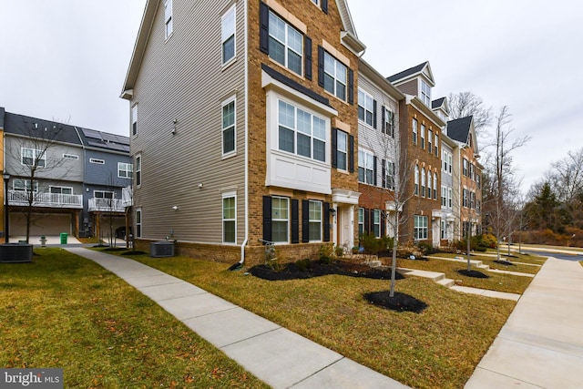 view of property featuring central AC unit