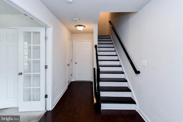 stairway featuring hardwood / wood-style flooring