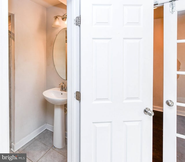 bathroom featuring tile patterned flooring and sink