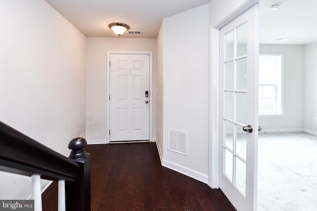 interior space with dark hardwood / wood-style flooring and french doors