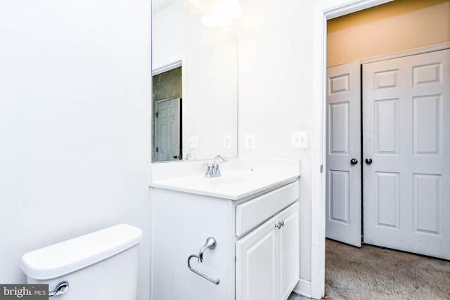 bathroom with vanity and toilet