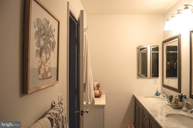 bathroom with double vanity and a sink