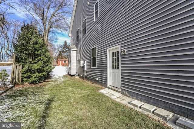 view of property exterior with a yard