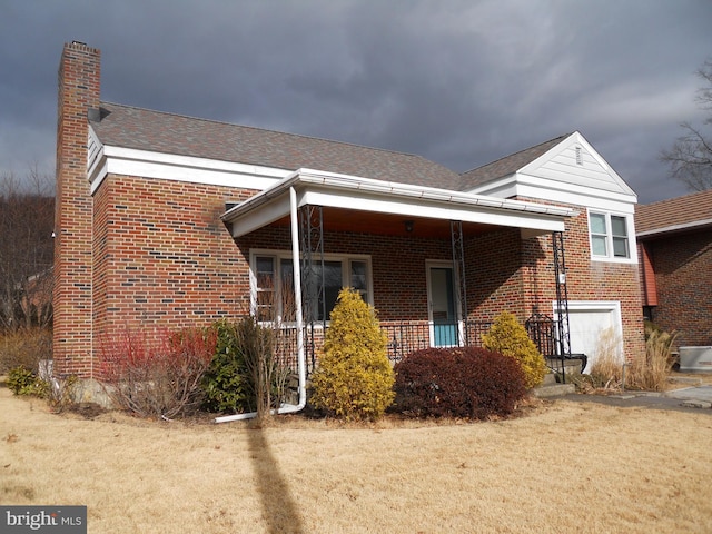 view of front facade with a garage and a front lawn