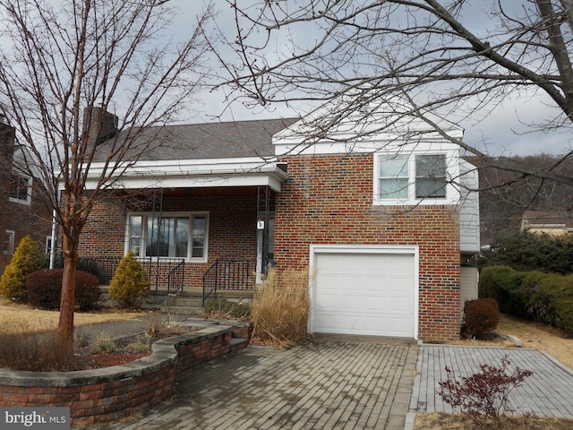 view of front of property with a garage