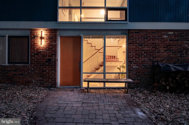 doorway to property with a patio