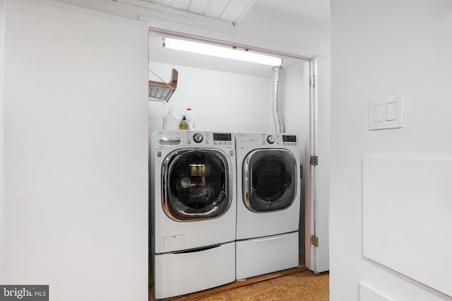 laundry area with separate washer and dryer