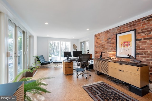 office space with brick wall and french doors