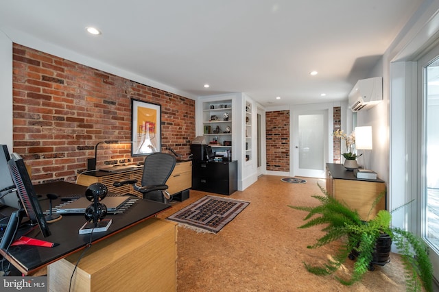 unfurnished office featuring a wall mounted air conditioner, built in features, and brick wall