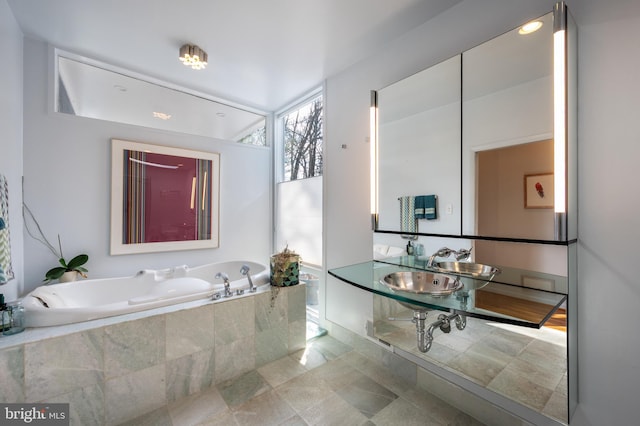 bathroom with tiled bath