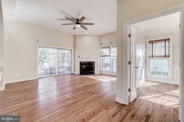 unfurnished living room with ceiling fan and light wood-type flooring