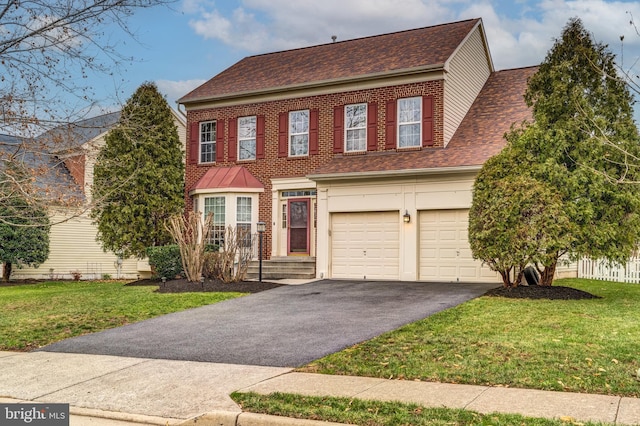 view of front of home featuring a garage and a front lawn