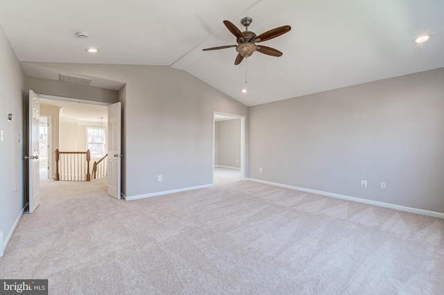 unfurnished bedroom with lofted ceiling, light colored carpet, and ceiling fan