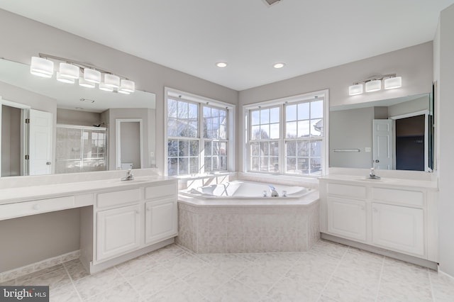 bathroom with vanity, tile patterned floors, and shower with separate bathtub