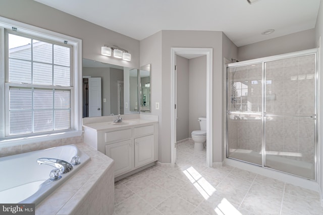 full bathroom featuring vanity, toilet, separate shower and tub, and tile patterned flooring