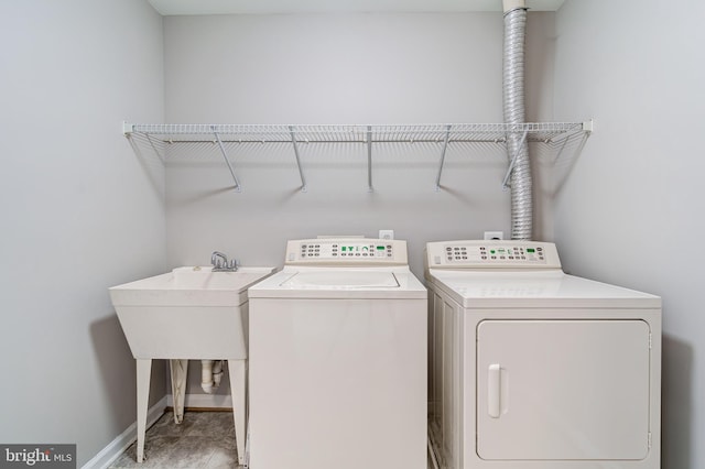 laundry room with separate washer and dryer